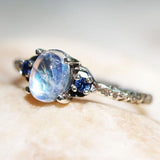 Moonstone-Look Oval Blue CZ Side Stone Ring