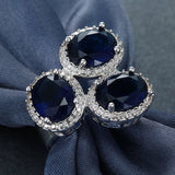 Sapphire-Blue Oval CZ Triple Halo Ring