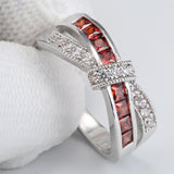 Garnet-Red Channel CZ Crisscross Bow Ring