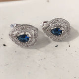 Sapphire-Blue Pear CZ Swirl Halo Earrings