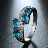 Aqua Oval CZ Four-Stone Bypass Ring