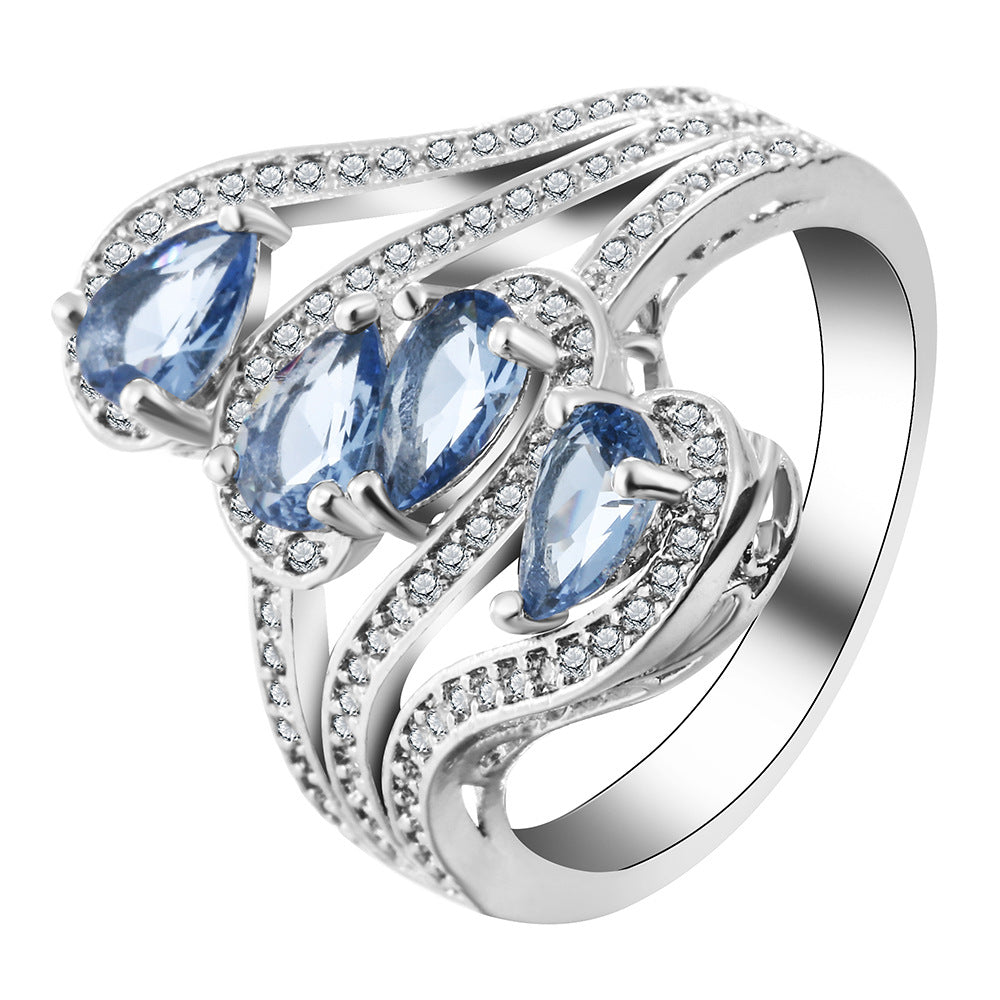 Light-Blue Pear CZ Four-Stone Swirl Ring