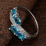 Aqua Oval CZ Four-Stone Bypass Ring