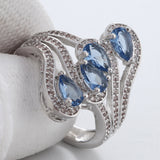 Light-Blue Pear CZ Four-Stone Swirl Ring