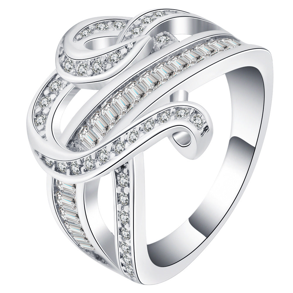 Pave Baguette CZ Swirl Crossover Ring