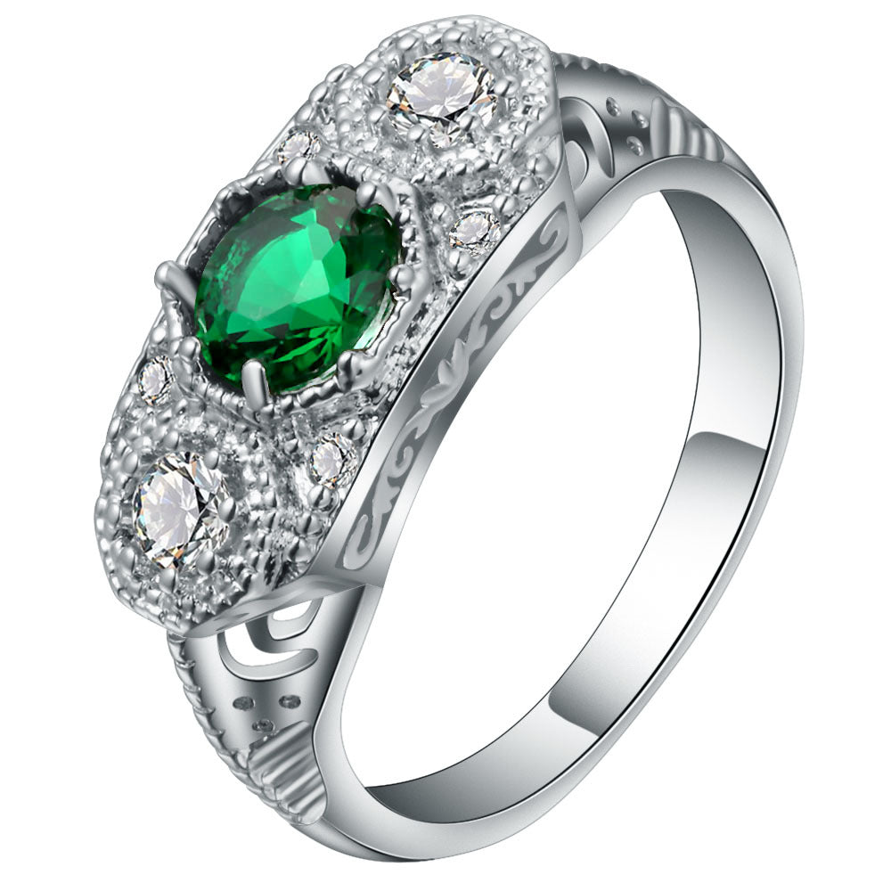 Emerald-Green Oval CZ Three-Stone Engraved Ring