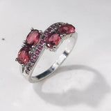 Aqua Oval CZ Four-Stone Bypass Ring
