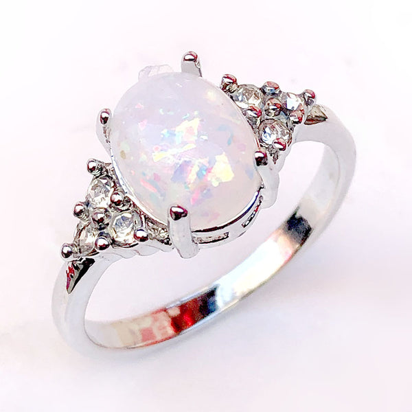 Oval Opal-Look Ring with CZ Side Clusters