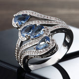 Light-Blue Pear CZ Four-Stone Swirl Ring