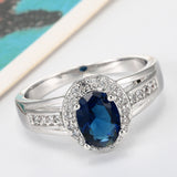 Sapphire-Blue Oval CZ Halo Split Shank Ring