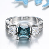 Teal Square CZ Three-Stone Ring