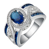 Sapphire-Blue Oval CZ Swirl Channel Ring