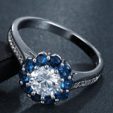 Round CZ Sapphire-Blue Flower Halo Ring