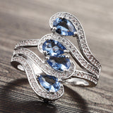 Light-Blue Pear CZ Four-Stone Swirl Ring