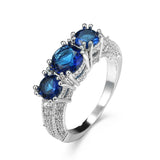 Emerald-Green Round CZ Three-Stone Pave Ring