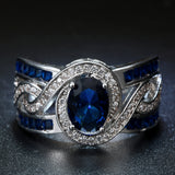 Sapphire-Blue Oval CZ Swirl Channel Ring