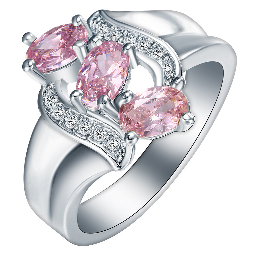 Pink Oval CZ Three-Stone Diagonal Ring