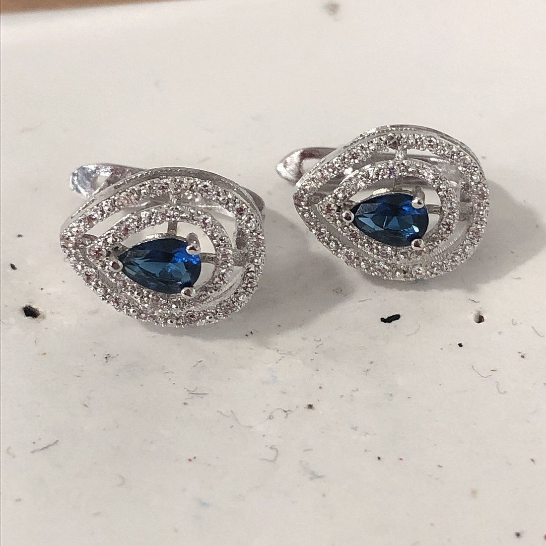 Sapphire-Blue Pear CZ Swirl Halo Earrings