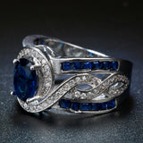 Sapphire-Blue Oval CZ Swirl Channel Ring