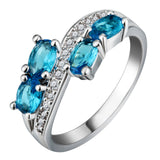 Aqua Oval CZ Four-Stone Bypass Ring