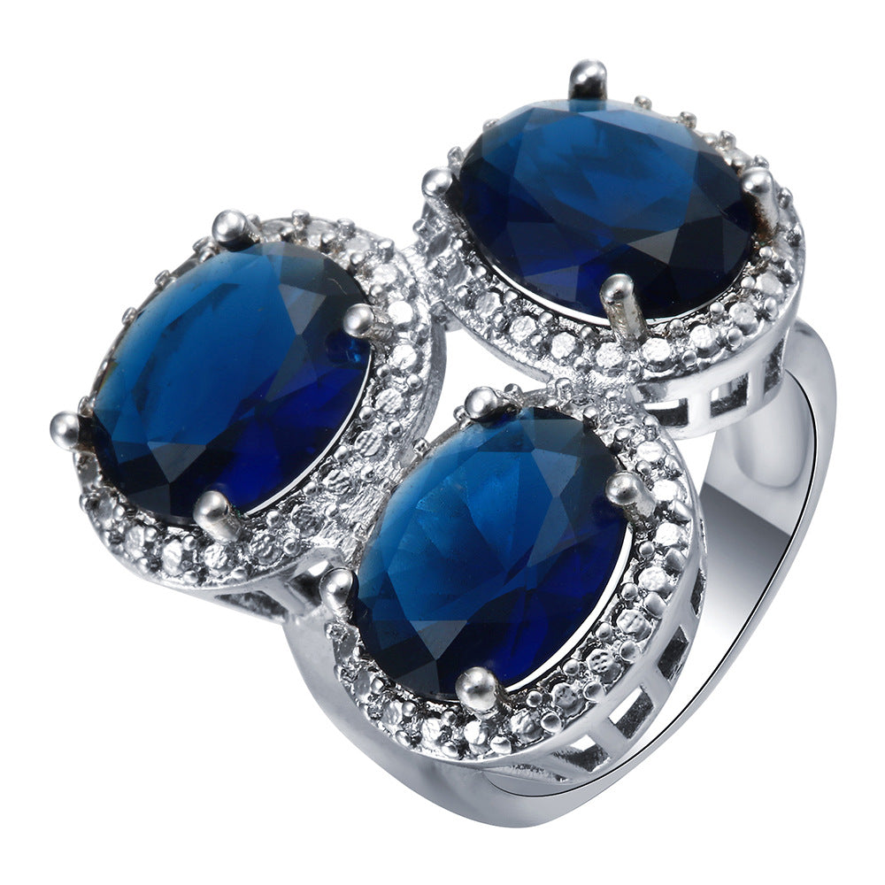Sapphire-Blue Oval CZ Triple Halo Ring
