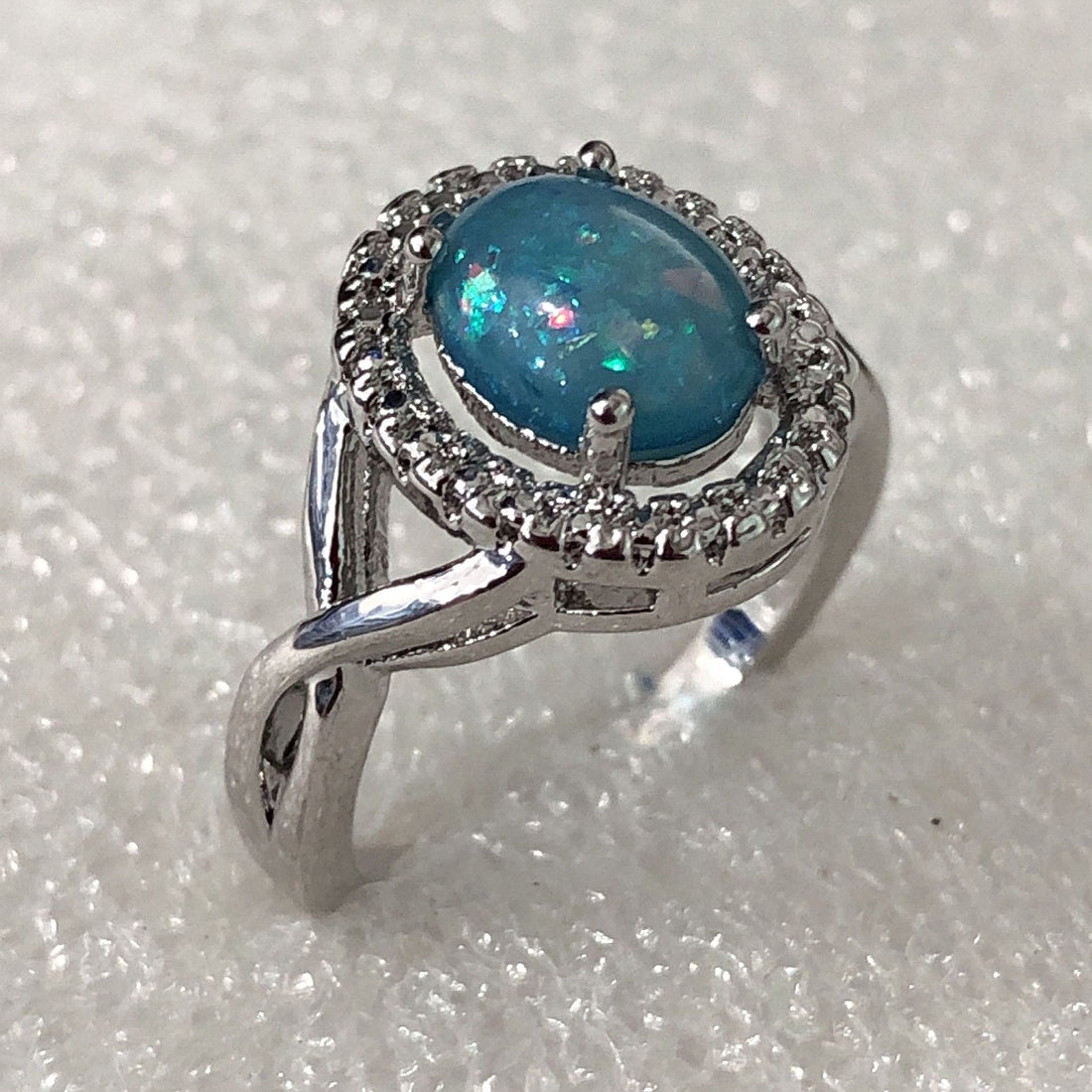 Blue Opal-Look Oval Halo Twist Shank Ring