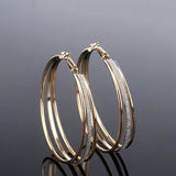 Gold Triple-Row Glitter Oval Hoop Earrings