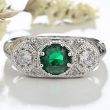 Emerald-Green Oval CZ Three-Stone Engraved Ring