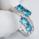 Aqua Oval CZ Four-Stone Bypass Ring