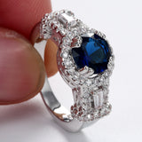 Sapphire-Blue Oval CZ Baguette Halo Ring