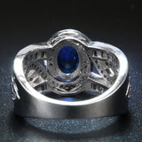 Sapphire-Blue Oval CZ Swirl Channel Ring