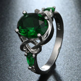 Emerald-Green Oval CZ Celtic Knot Three-Stone Ring